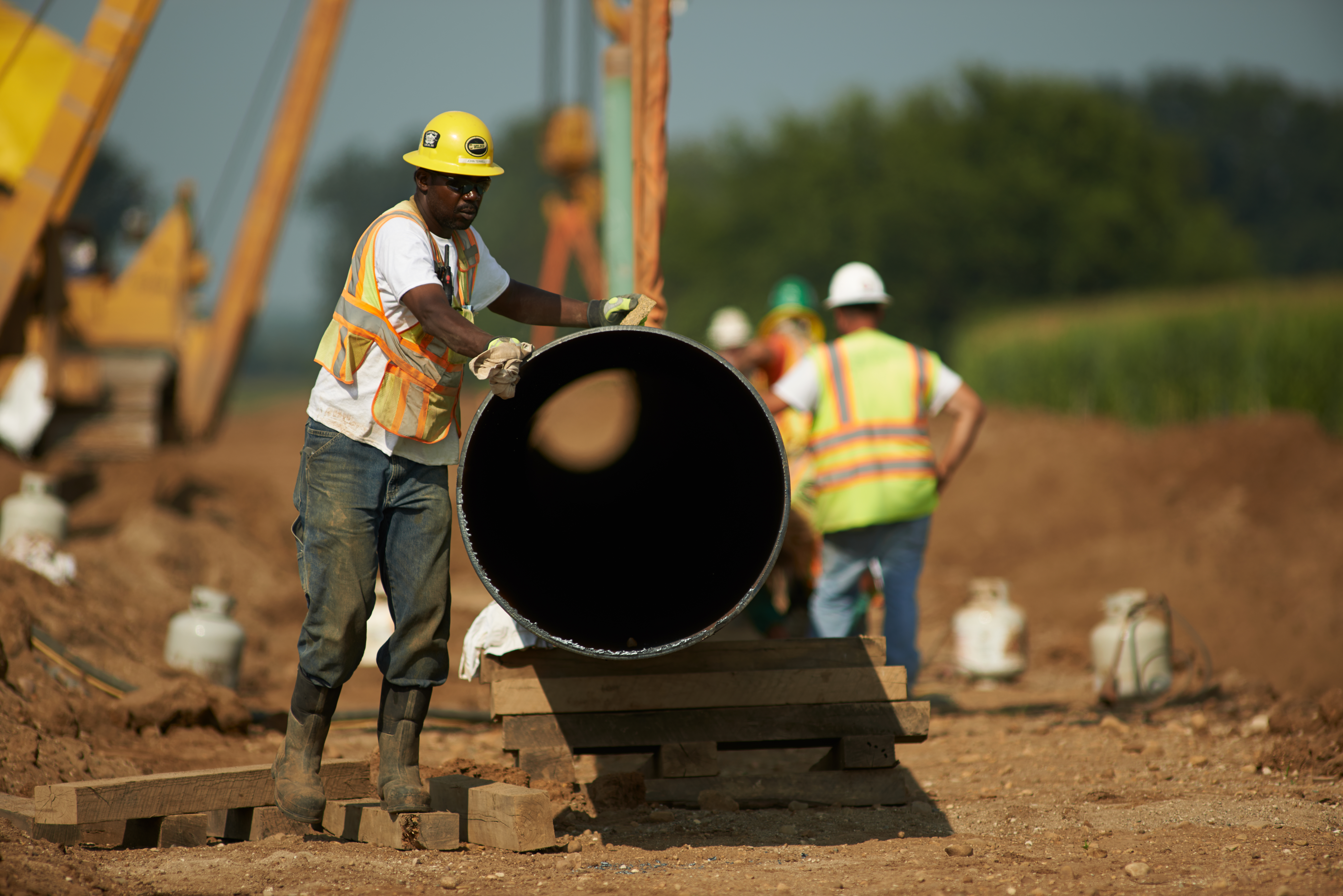 consumers energy workers putting in natural gas pipelines